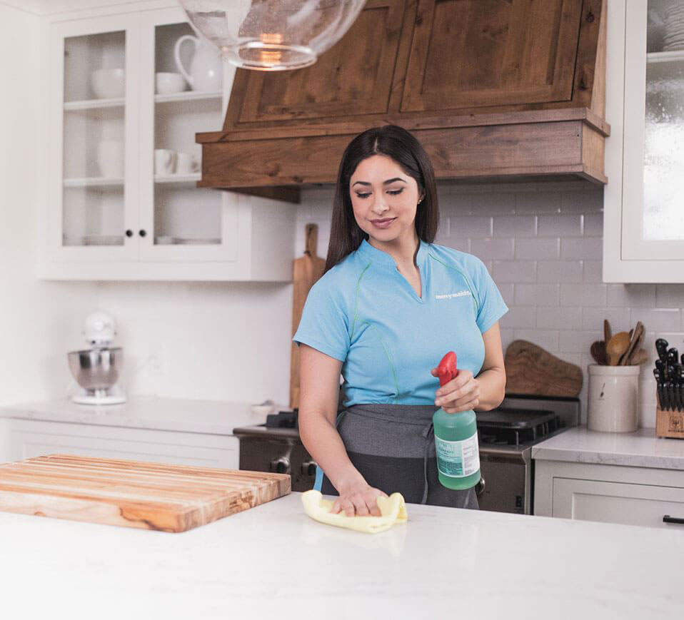 merry maids women cleaning table