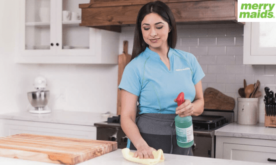 merry maids women cleaning table