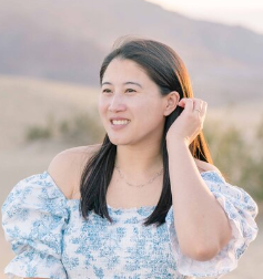 a woman posing for photo suit